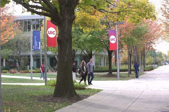 Students walk across UIC's campus.