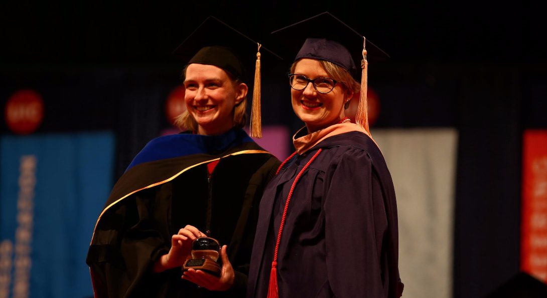 A student receives an award at the 2018 Commencement ceremony.