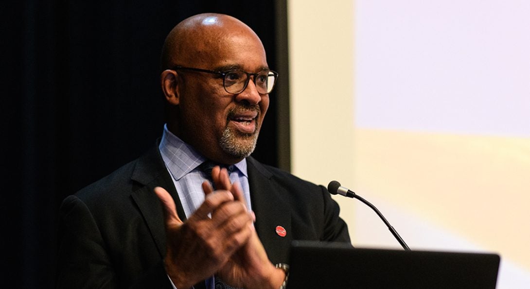 Dean Wayne H. Giles speaks at a podium during Research and Practice Awards Day 2019.