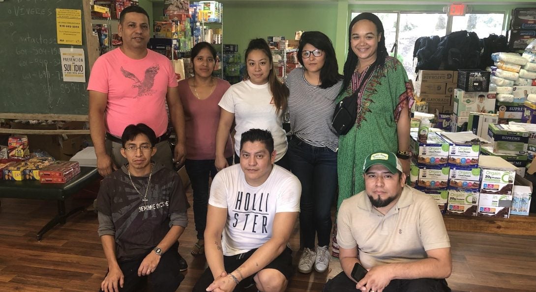 Kim and Gabby with volunteers at St. Ann’s Church.