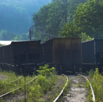 Coal hoppers are parked on railroad tracks outside a coal mine in Kentucky. 
