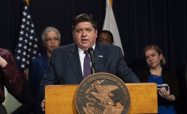Governor Pritzker announces Illinois' shelter-in-place order at a press conference.