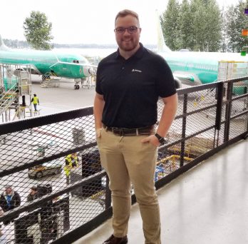 Benjamin Tate poses for a photo at Boeing's Everett, Washington plant.
                  