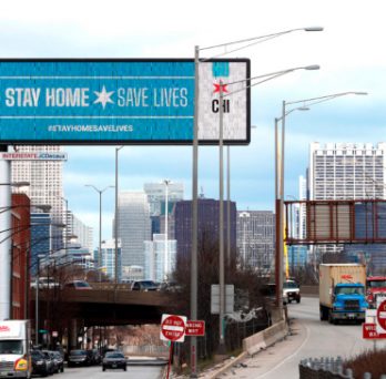 A digital billboard along a Chicago expressway states 