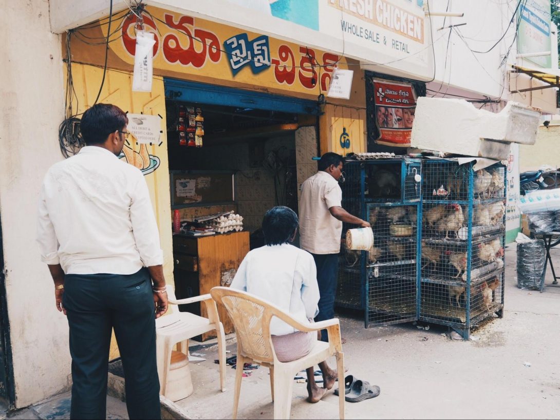 photo 2. A chicken store in Hyderabad, India, with a banner of 