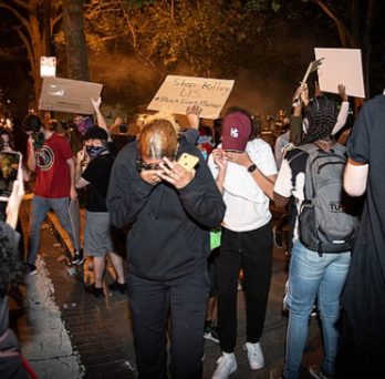 Protesters react to tear gas at George Floyd protests in Washington, D.C. 