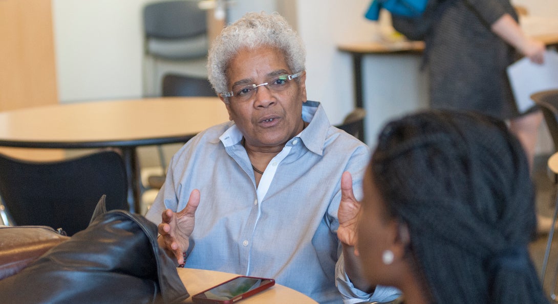 Linda Rae Murray talks with an SPH student.