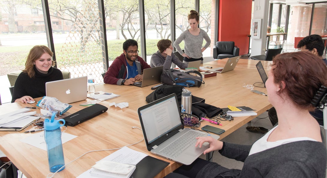 Students on the interdisciplinary product development team work in the UIC Innovation Center.