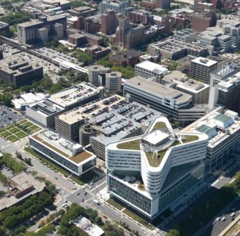 An aerial view of Rush University Medical Center, with UIC's  health sciences campus in the background.
                  