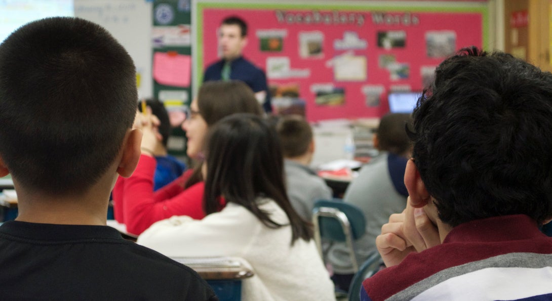 Students listen to a presentation by their teacher in a CPS classroom.