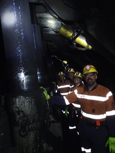 Coal miners pose for a picture wearing their protective gear in the CarboroughDowns Mine in Queensland, Australia.