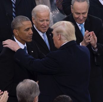 President Donald Trump shares a moment with outgoing President Barack Obama and Vice President Joe Biden at the 2016 inauguration.
                  