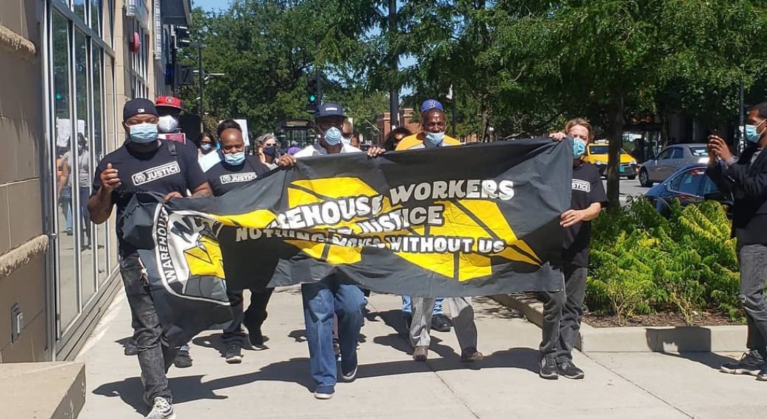 Warehouse Workers for Justice stage a protest walking down a street in Chicago.