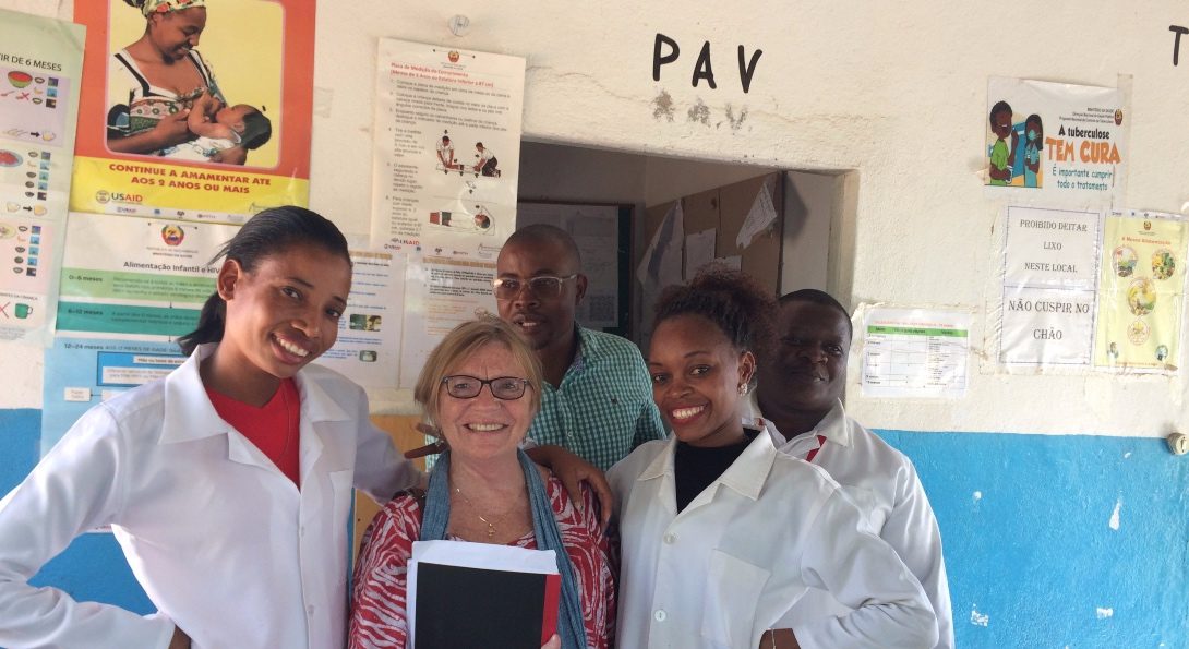 Mary Harvey poses for a picture with health center workers on a monitoring visit in Nampula, Mozambique.
