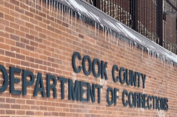 A brick wall and sign denoting the Cook County Department of Corrections.