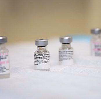 Four vials of the COVID-19 vaccine. 