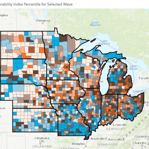 A map showing COVID-19 case rates across Midwest counties.