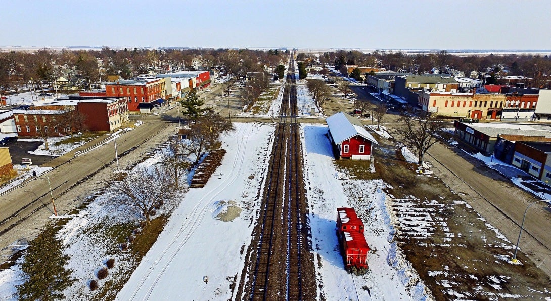 An aerial view of the town of Bushnell, Illinois, bisected by railroad tracks.