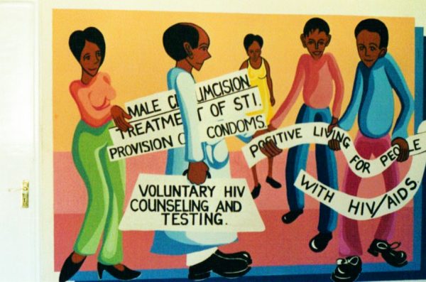 A mural in Kisumu promotes use of condoms and circumcision to prevent HIV transmission.