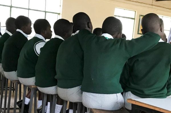 Students in a Kisumu school listen to a presentation on sexual and reproductive health.