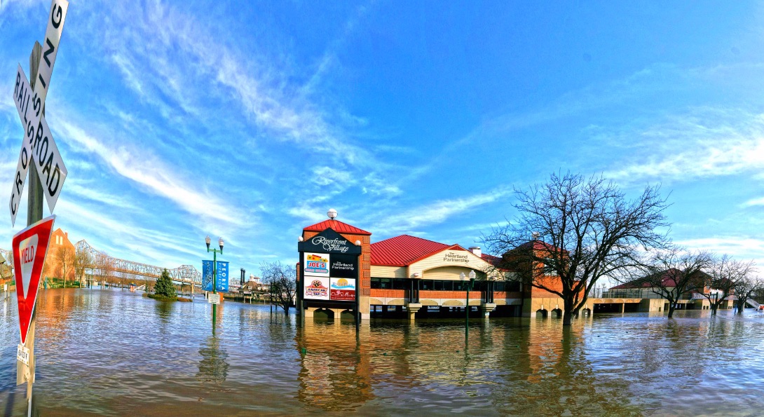 Floodwaters cover a Peoria, Illinois mall parking lot.