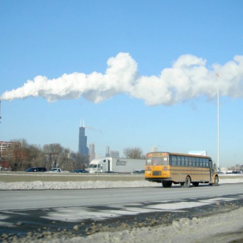 The Crawford Generating Station in Chicago emitting a large cloud of white smoke.
