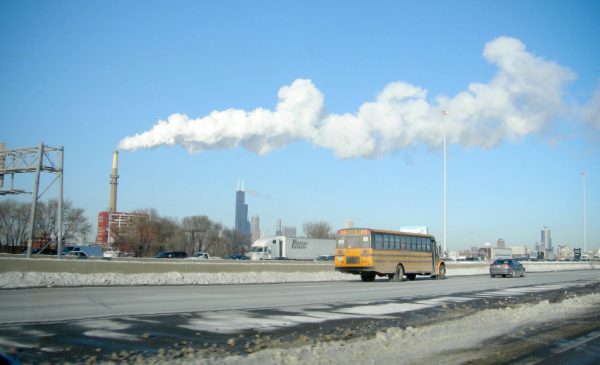 A school bus travels past the Crawford Generating Station in Chicago.