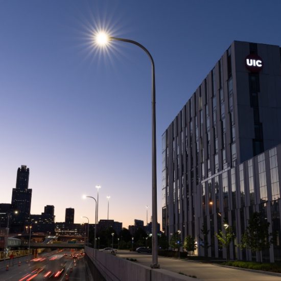 UIC's campus and the Chicago skyline at dawn.