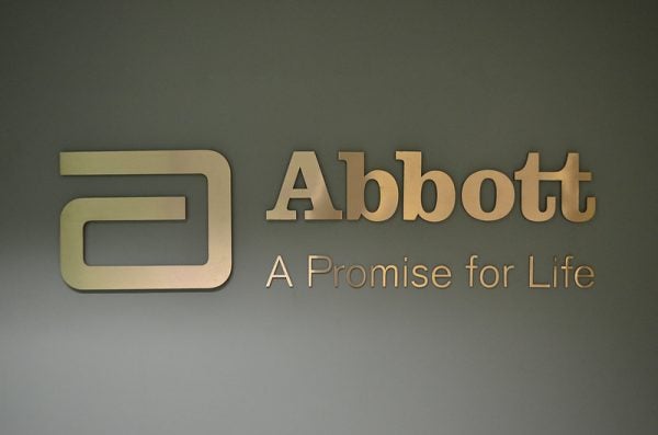 An exterior sign for Abbott Laboratories, stating a slogan:  