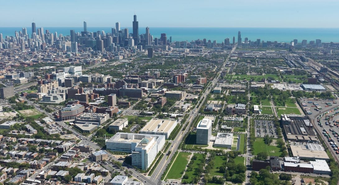 UIC's west campus and School of Public Health building, with the Chicago skyline in the background.