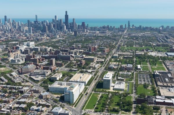 An aerial view of the Illinois Medical District, with the Chicago Loop and Lake Michigan in the background.