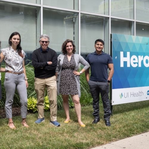 Members of UIC's contact tracing team pose for a photo outside a UI Health building.