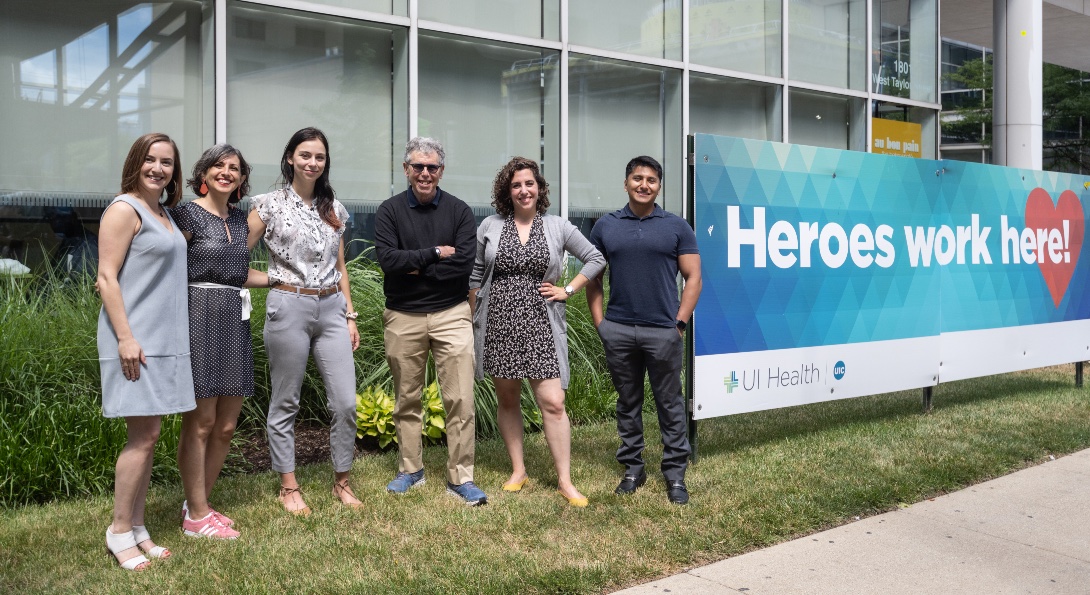 Members of SPH's contact tracing team pose for a photo outside a UI Health building.
