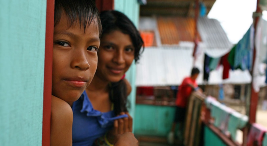 A photo of two older children in Belén, a region of Iquitos in Peru.