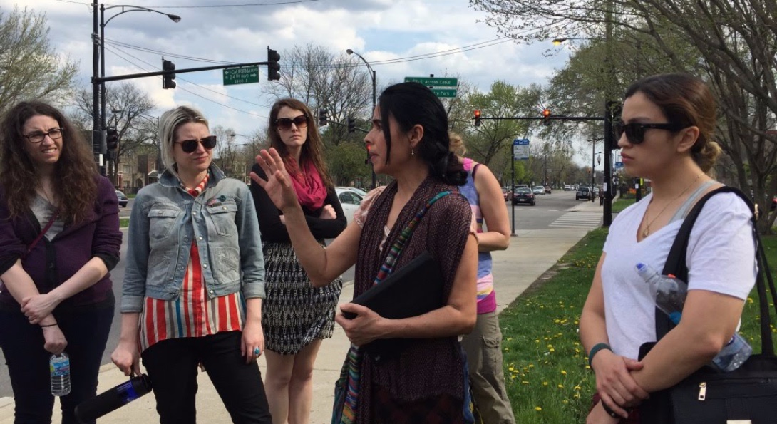 SPH students discussing a community needs assessment on a street corner in Chicago.