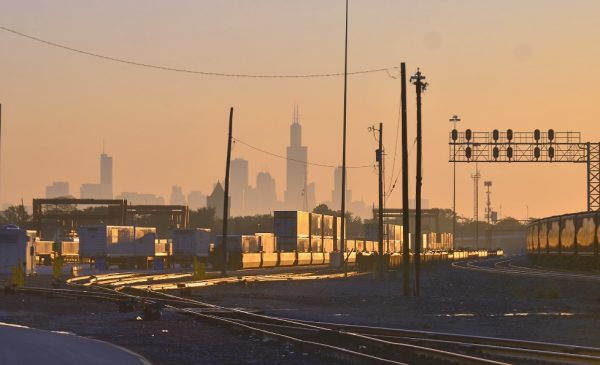 A rail yard in Chicago, with the Chicago skyline in the background.