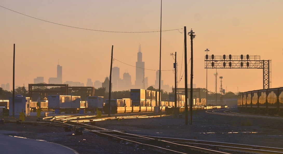 A rail yard in Chicago, with the Chicago skyline in the background.