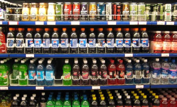 Rows of soda and other sweetened beverages at a grocery store.