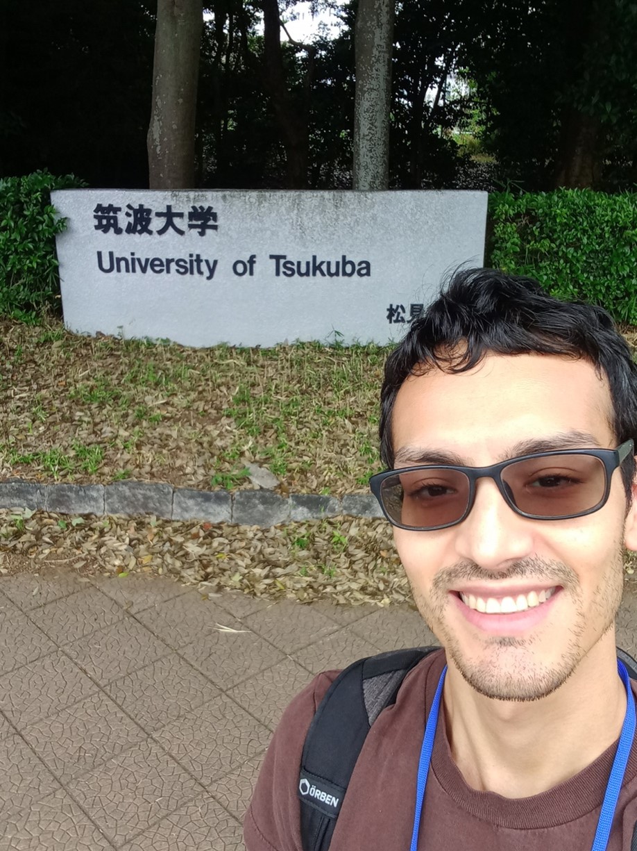 Miguel Nunez in front of University of Tsukuba sign.
