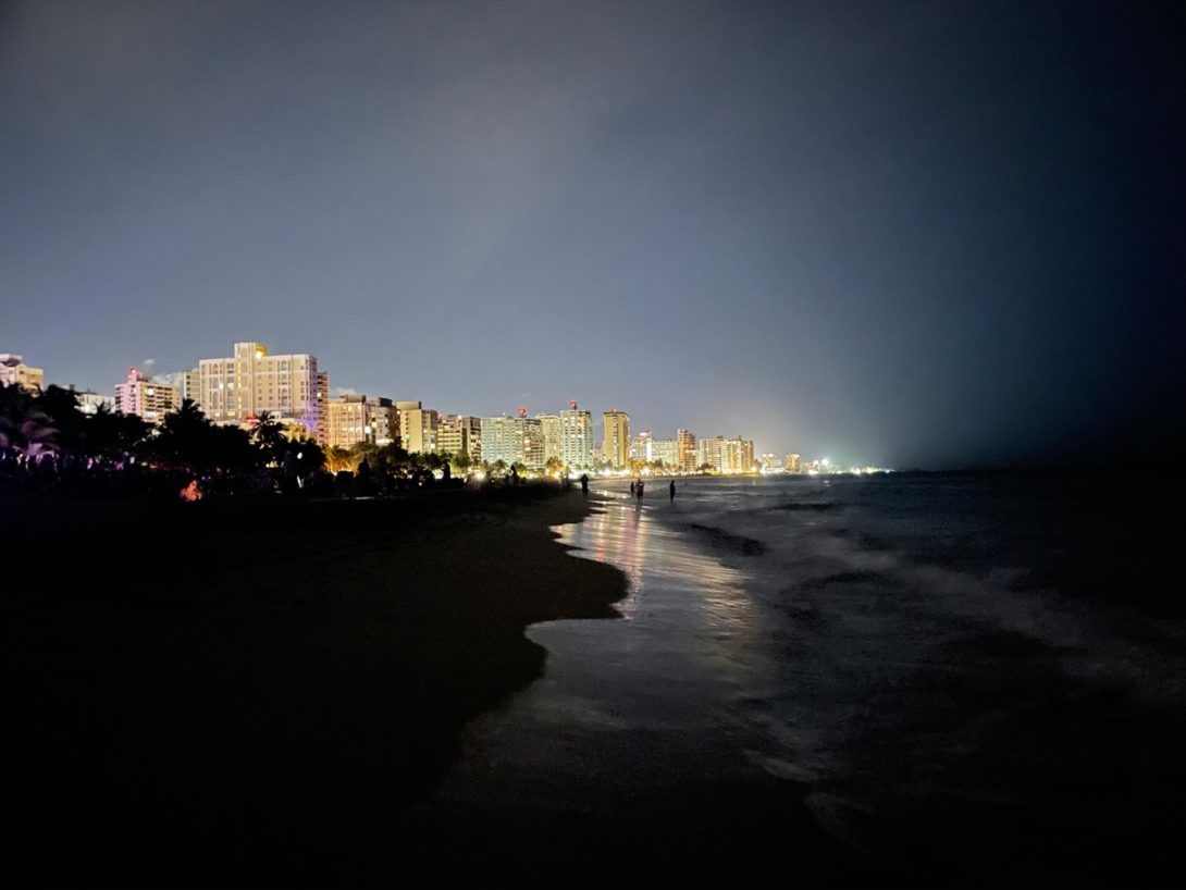 Beach view of San Juan at night.