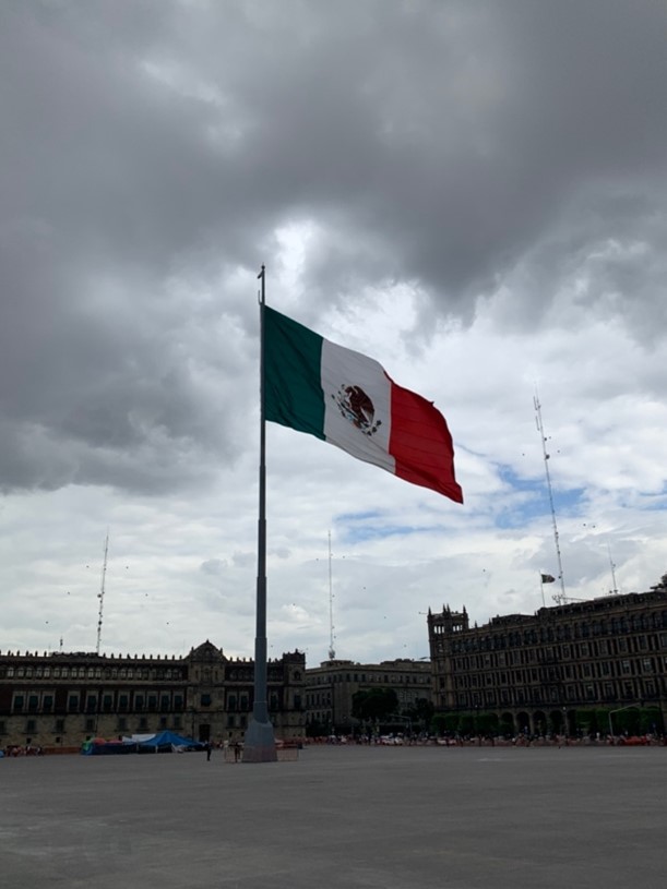 Middle of Zocalo with flag of Mexico.
