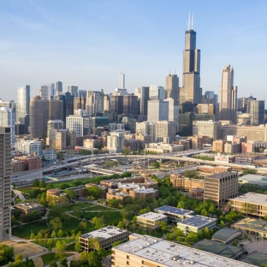 An aerial view of the Chicago skyline, with UIC's campus in the foreground.