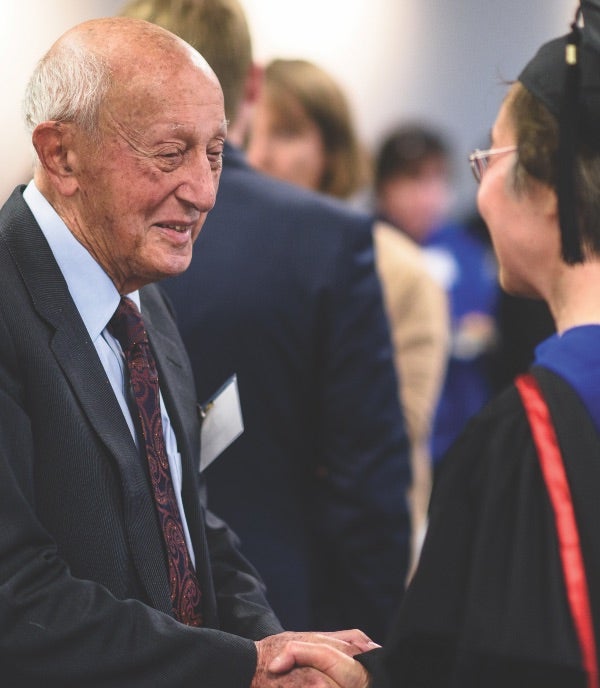 Samuel Epstein congratules SPH’s An Li, PhD, after she was named the Dr. Samuel and Mrs. Catherine Epstein Term Professor in Cancer Prevention.