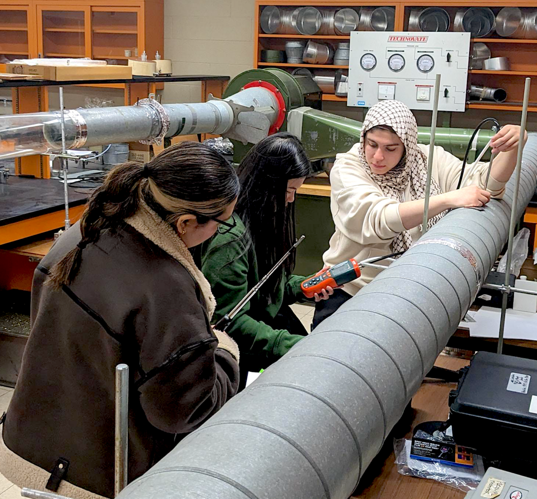 Industrial hygiene students work together during a ventilation lab.